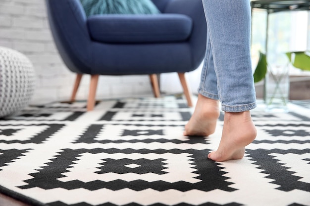 Woman walking on carpet at home