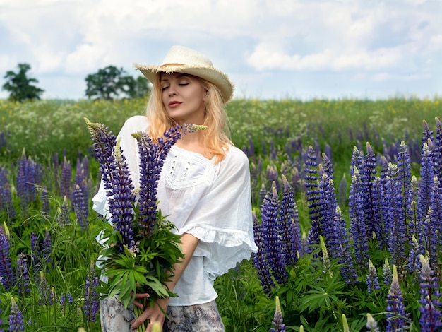 Woman walking through a blooming meadow