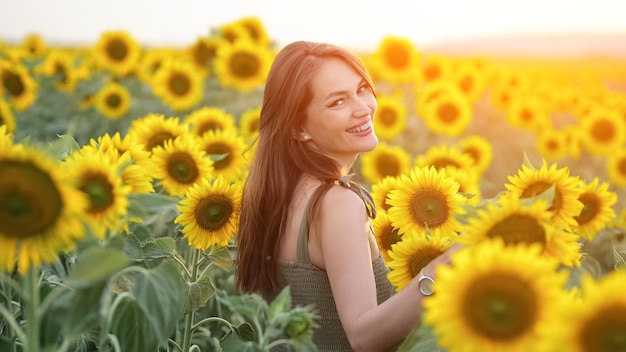 Woman walks through sunflowers enjoying vivid moments