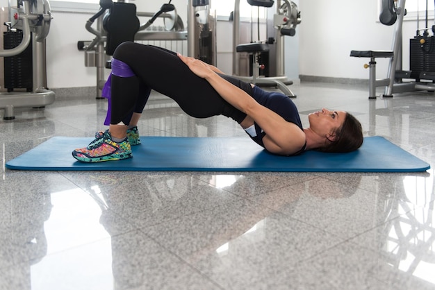 Woman Warms Up With the Latex Resistance Band