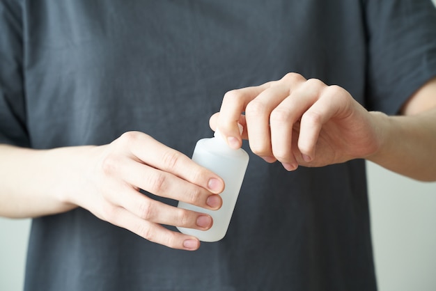 Woman wash hand sanitizer gel, to prevent illness Novel coronavirus (2019-nCoV) after public place