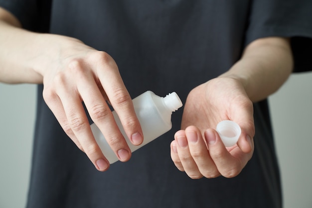 Woman wash hand sanitizer gel, to prevent illness Novel coronavirus (2019-nCoV) after public place