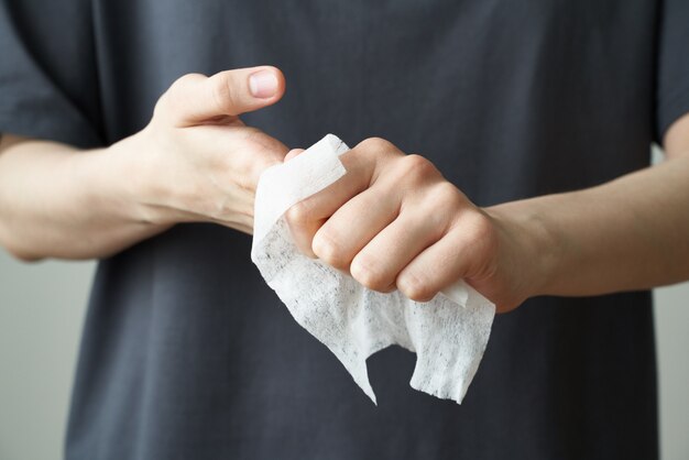 Woman wash hand wet wipes, to prevent illness Novel coronavirus (2019-nCoV) after public place