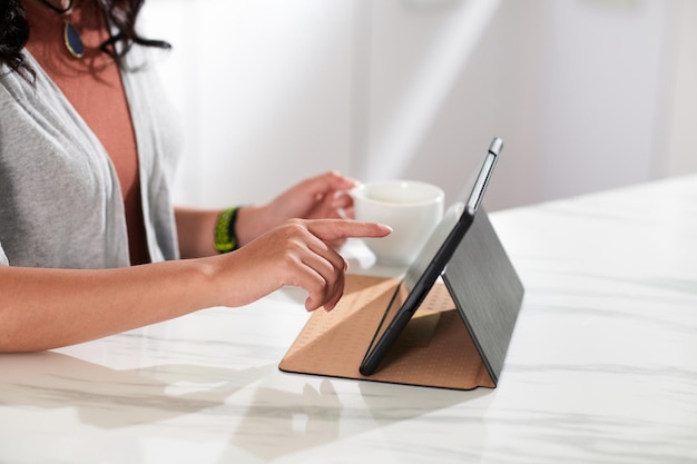 Woman watching video online on tablet pc