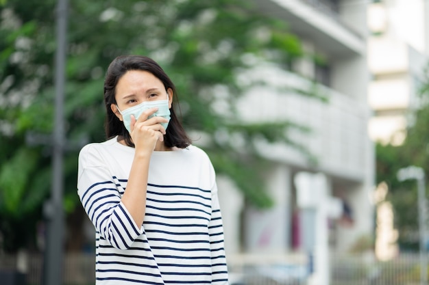 Woman wearing face mask protect filter against air pollution (PM2.5) or wear N95