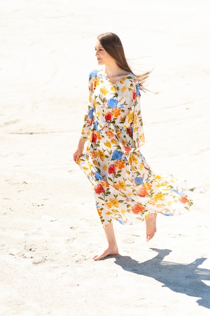 Woman wearing fashion tunic on the beach