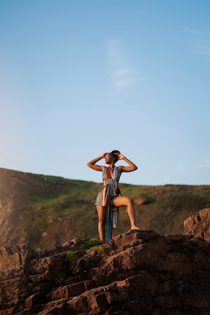 Woman wearing native african clothing on mountain