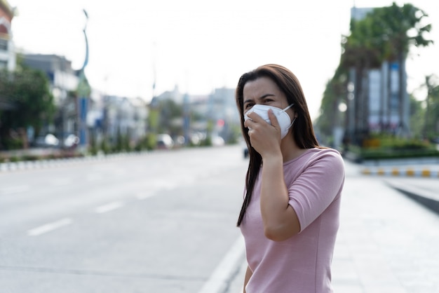 Woman wearing Protective face mask for Coronavirus and pm 2.5 fighting