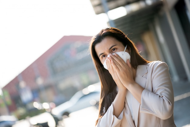 Woman wearing Protective face mask and cough, Coronavirus and pm 2.5 fighting