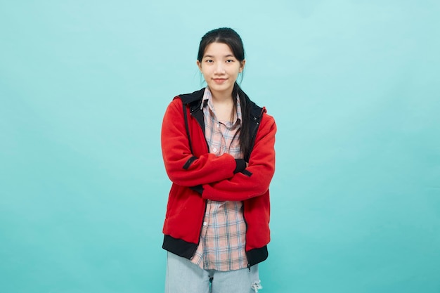 Woman wearing a red jacket smile looking confident at the camera studio lifestyle