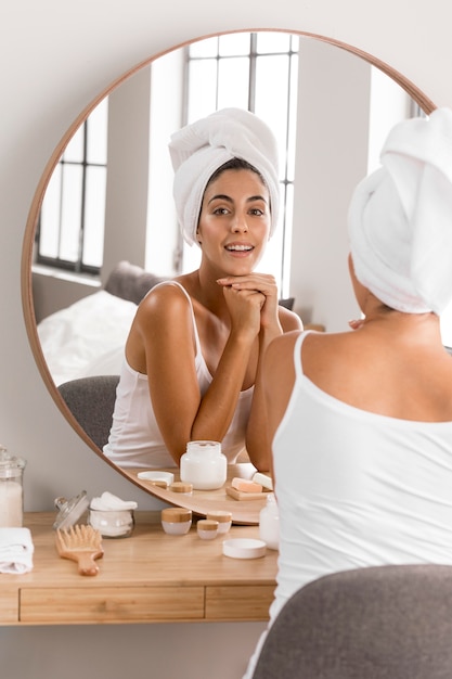 Woman wearing a towel self care concept