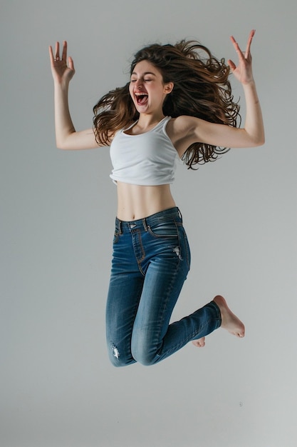 a woman in a white shirt with her hair up in the air