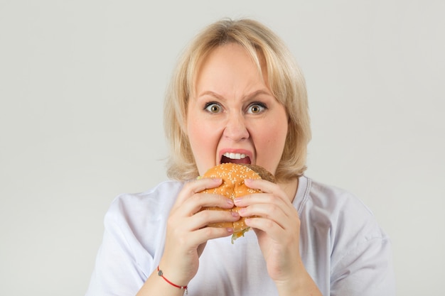 Woman in a white t-shirt with a hamburger