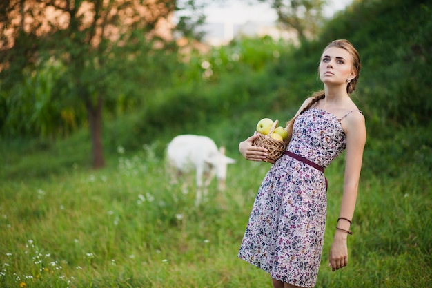 Woman with apples in nature