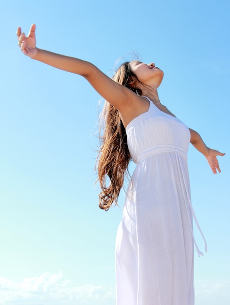 Woman with arms open enjoying her freedom