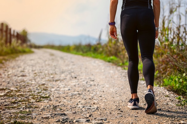 Woman with athletic legs walking