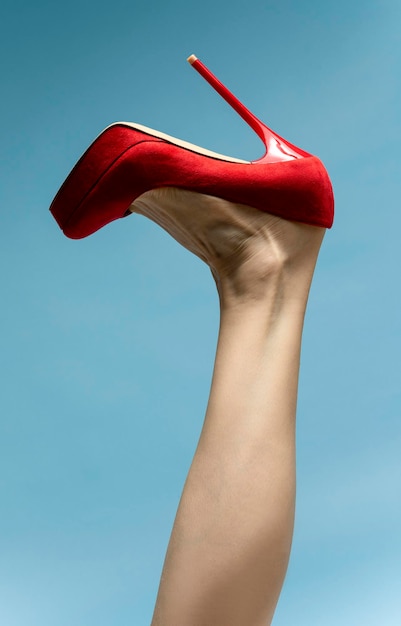 woman with beautiful legs wearing red high hills.