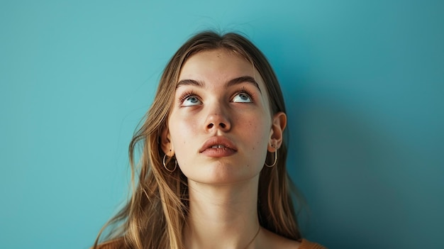 a woman with blonde hair and a blue background