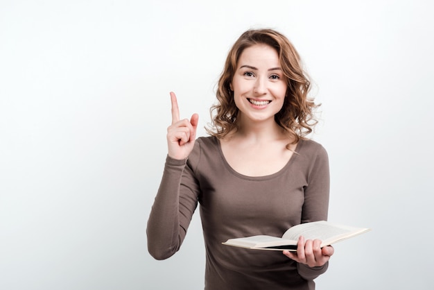 The woman with the book in her hands raised her thumb up, found a solution