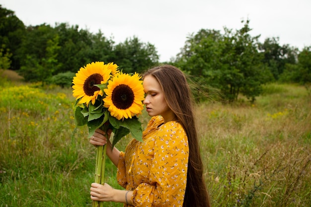 Woman with a bouquet of sunflowers