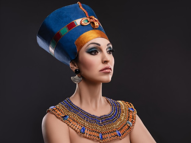 woman with brown eyes and evening makeup as queen of Egypt Cleopatra