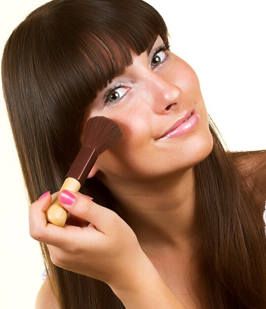 woman with brush for blush isolated on white