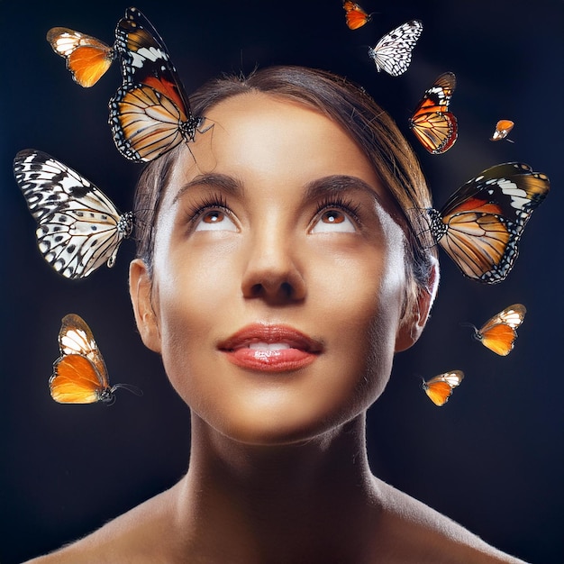 a woman with butterflies around her face and the words butterfly on it