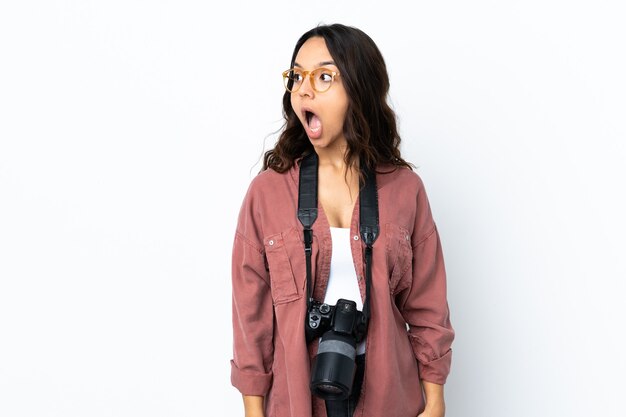 Woman with a camera in studio