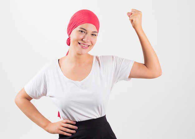 Woman with cancer wearing pink scarf