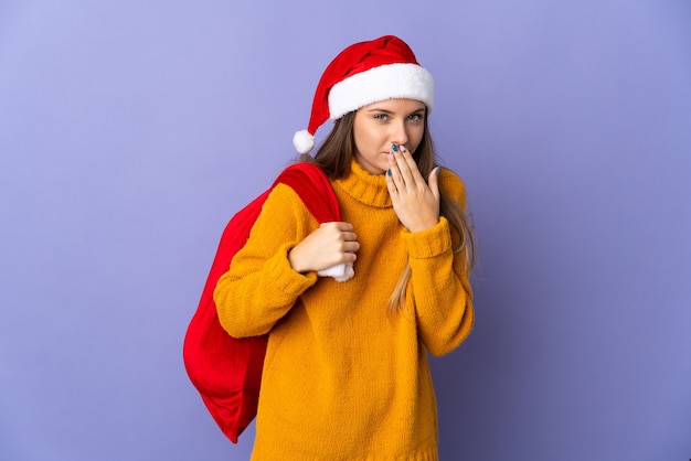 woman with christmas hat and santa bag