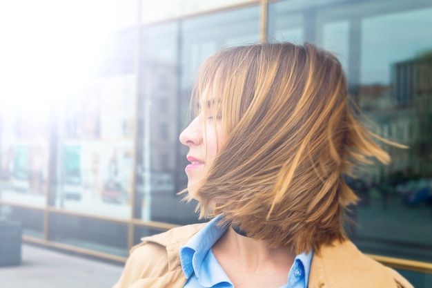 Woman with closed eyes smiling new day