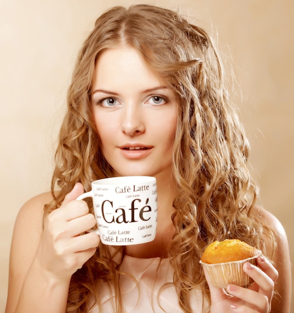 Woman with coffee and cake