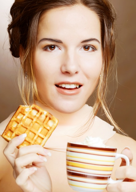 Woman with coffee and cookies