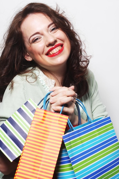 Woman with colored shopping bags