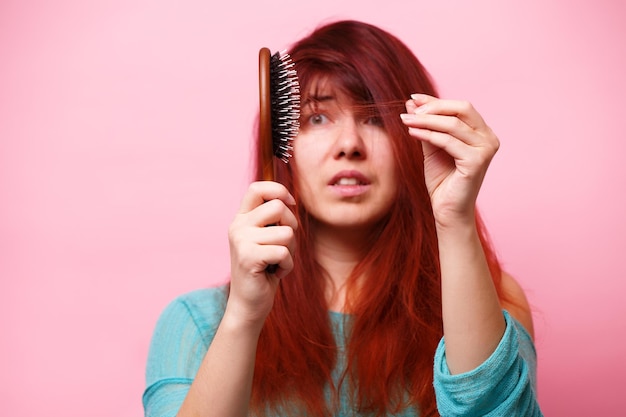 Woman with a comb and problem hair