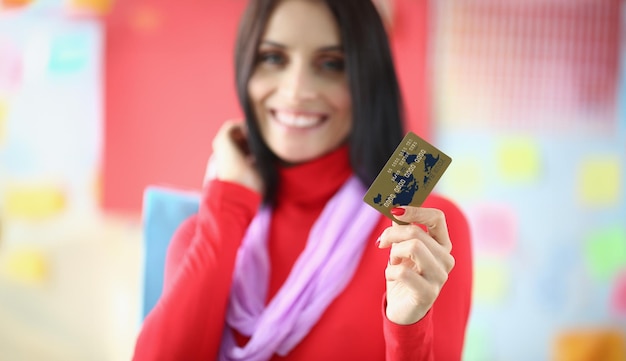 Woman with credit card for shopping in closeup