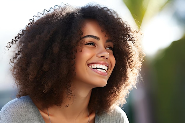 a woman with curly hair smiling