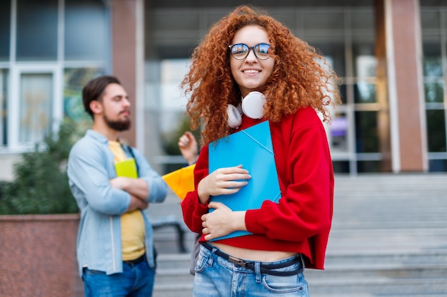 Woman with curly red hair at university admission