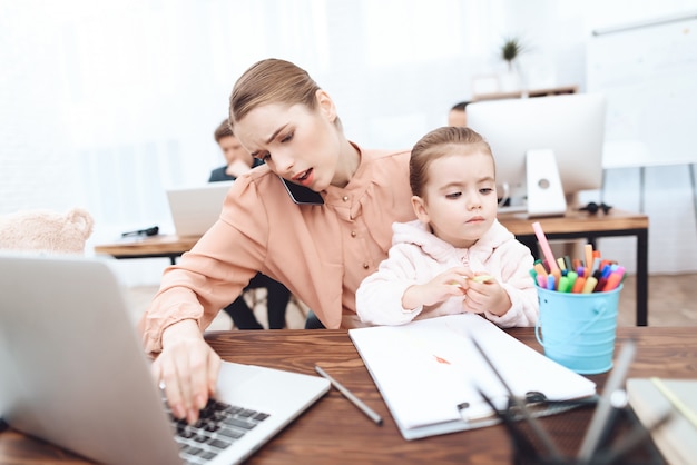 The woman with daughter come to work.