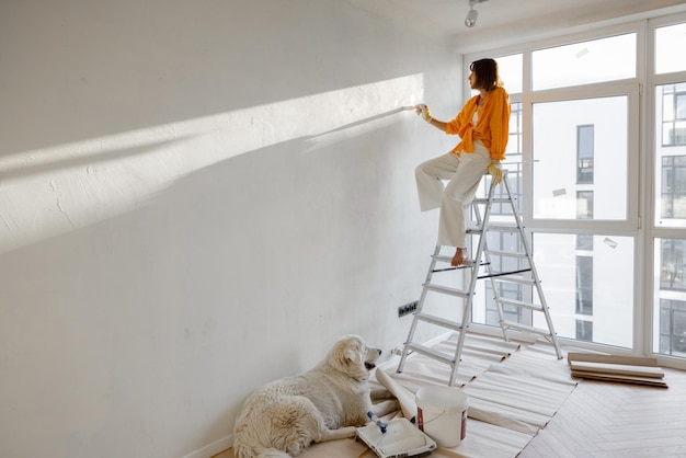 Woman with dog renovating house