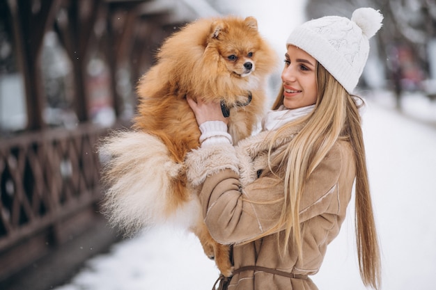 Woman with dog in winter