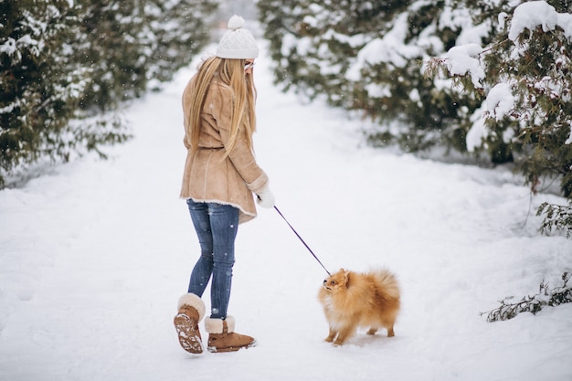 Woman with dog in winter