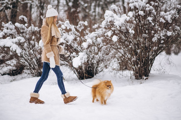 Woman with dog in winter