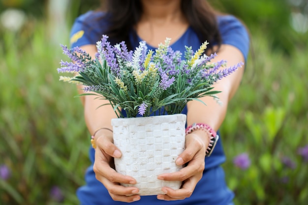 A woman with a flower pot