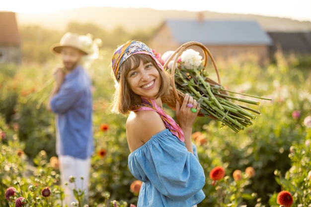 Woman with flowers on dahlia farm outdoors