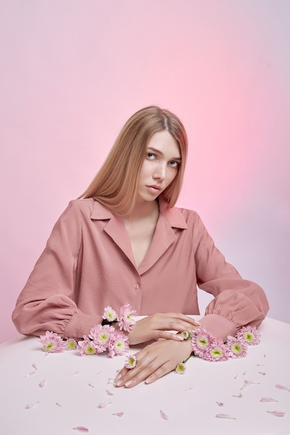 Woman with flowers in her hand and sleeves