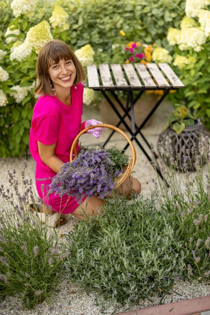 Woman with freshly picked lavender flowers at garden