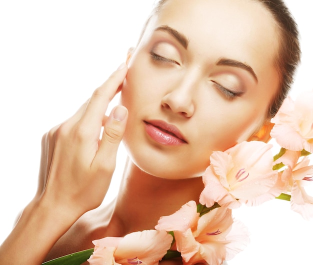 Woman with gladiolus flowers in her hands