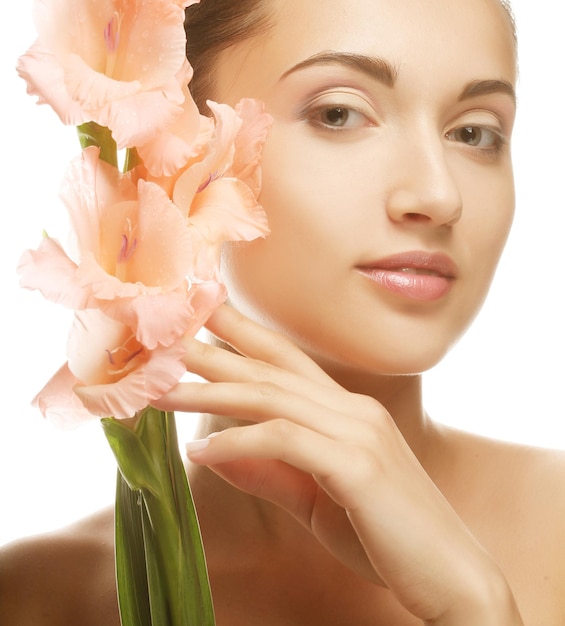 Woman with gladiolus flowers in her hands