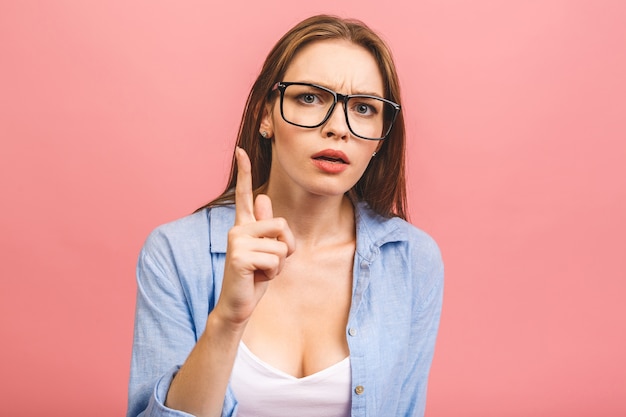 Woman with glasses posing in studio